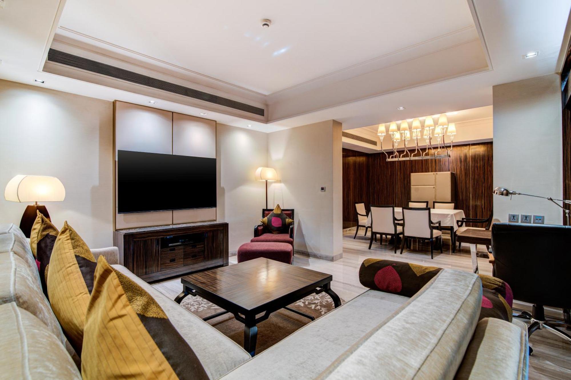 Hyatt Ahmedabad Hotell Exteriör bild A living room in a suite at the Taj Mahal Palace, Mumbai